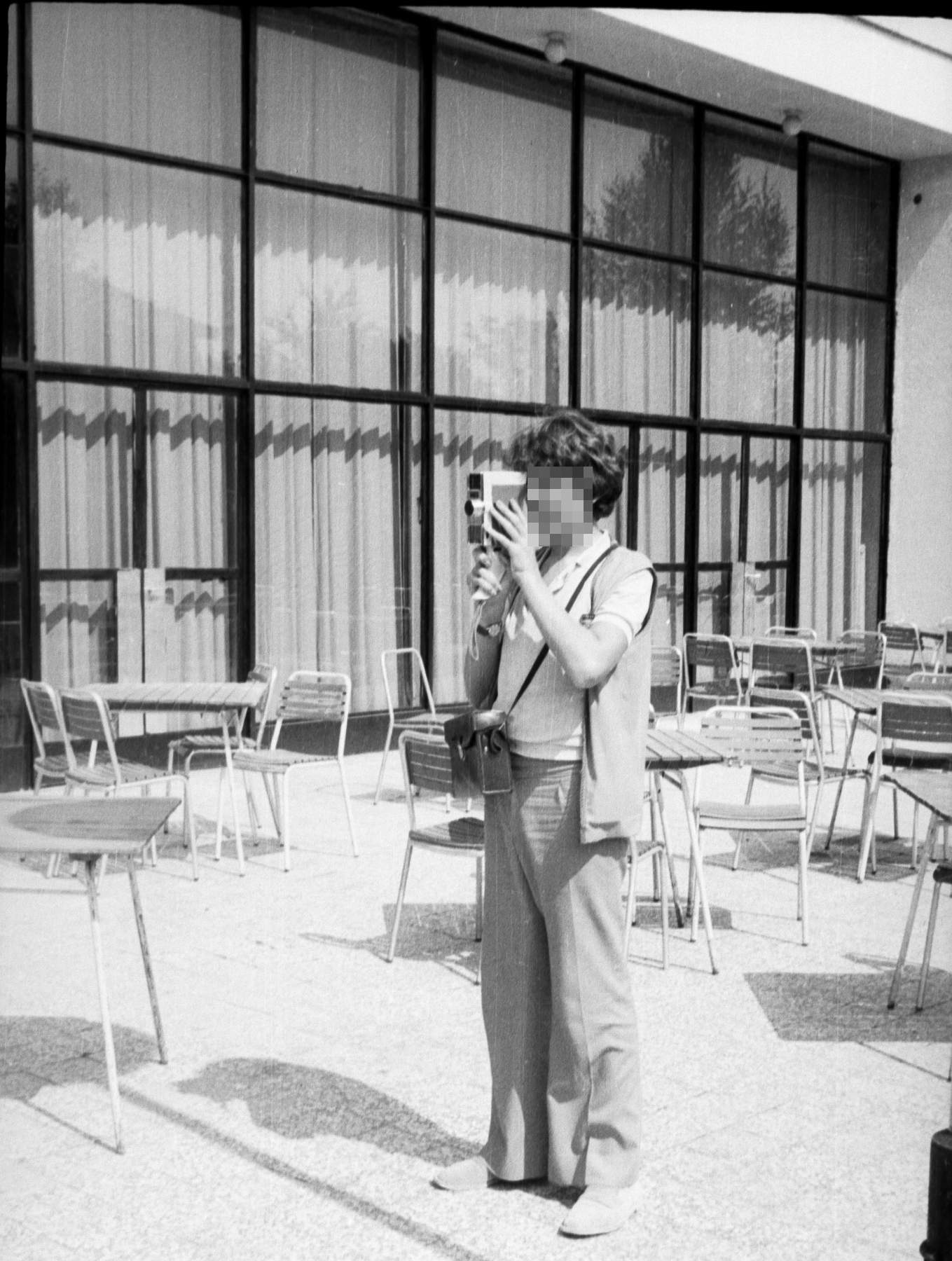 Me, with the MeOpta czech camera from school. The glass box behind is that tourism school. And this is my prom outfit.